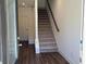 Inviting entryway featuring hardwood floors and a staircase leading to the upper level at 1616 Avery Way, Tucker, GA 30084