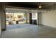 Open two car garage with poured concrete floors, insulated garage door, and unfinished walls at 1616 Avery Way, Tucker, GA 30084