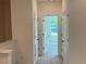 Upstairs hallway with carpeted flooring and white doors at 1616 Avery Way, Tucker, GA 30084