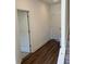 Bright hallway featuring hardwood flooring and white doors at 1616 Avery Way, Tucker, GA 30084