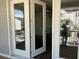 Open french doors leading to a patio with a view of the exterior at 1616 Avery Way, Tucker, GA 30084