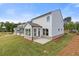 Backyard view showcasing a well-maintained lawn and multiple outdoor spaces at 1954 William Glen St, Dacula, GA 30019