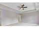 Bedroom featuring neutral colors, a ceiling fan and tray ceiling at 1954 William Glen St, Dacula, GA 30019