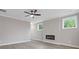 Living room with neutral walls, fireplace and views from windows at 1954 William Glen St, Dacula, GA 30019
