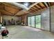 Spacious unfinished basement features a brick fireplace and sliding glass doors to the backyard at 2680 Spalding Dr, Atlanta, GA 30350
