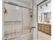 Bathroom shower and tile, plus a view into ensuite bathroom at 2680 Spalding Dr, Atlanta, GA 30350