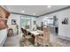Open dining area features a decorative rug, stylish table setting and lots of natural light at 2680 Spalding Dr, Atlanta, GA 30350