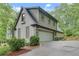 Charming home with a two-car garage, brick accents, and well-maintained landscaping, offering curb appeal and convenience at 2680 Spalding Dr, Atlanta, GA 30350