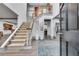 Bright foyer with tall ceilings, an elegant staircase, hardwood floors, and neutral decor at 2680 Spalding Dr, Atlanta, GA 30350