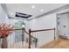 Hallway with hardwood floors, elegant lighting fixture and lots of natural light at 2680 Spalding Dr, Atlanta, GA 30350