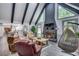 Bright living room features high ceilings, exposed beams, and a cozy fireplace at 2680 Spalding Dr, Atlanta, GA 30350