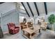Spacious living area boasts high ceilings, decorative beams, and ample seating at 2680 Spalding Dr, Atlanta, GA 30350