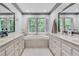 Well-lit main bathroom features a large soaking tub and dual vanities at 2680 Spalding Dr, Atlanta, GA 30350