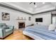 Cozy main bedroom features fireplace, tray ceiling, and plenty of natural light at 2680 Spalding Dr, Atlanta, GA 30350