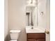Cozy bathroom featuring a vanity with sink, modern fixtures, and a large mirror at 909 Pine Cove Dr, Lilburn, GA 30047