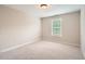 Neutral bedroom with plush carpet and a window at 909 Pine Cove Dr, Lilburn, GA 30047