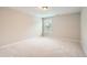 Bright bedroom featuring neutral walls, carpet and natural light from a window at 909 Pine Cove Dr, Lilburn, GA 30047