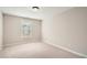 Neutral bedroom with plush carpet and a window at 909 Pine Cove Dr, Lilburn, GA 30047