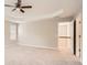 Open main bedroom featuring plush carpet, tray ceilings, and neutral colors at 909 Pine Cove Dr, Lilburn, GA 30047