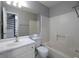 Bright bathroom features a single vanity, toilet, and shower-tub combo at 1903 Brittania Cir, Woodstock, GA 30188