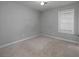Bright bedroom featuring neutral paint and carpet flooring at 1903 Brittania Cir, Woodstock, GA 30188