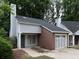 Charming home featuring brick and gray siding, complemented by a well-maintained front yard at 1903 Brittania Cir, Woodstock, GA 30188