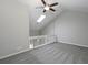 Spacious living room with vaulted ceilings, ceiling fan and carpet flooring at 1903 Brittania Cir, Woodstock, GA 30188