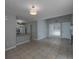 Open living room with tile floors, ample natural light, leading into a kitchen and front entrance at 1903 Brittania Cir, Woodstock, GA 30188