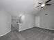 Second spacious living room with vaulted ceilings, ceiling fan and carpet flooring at 1903 Brittania Cir, Woodstock, GA 30188