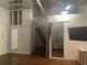 Unique bedroom area with built-in loft, ladder, sleeping alcove, mounted tv, and storage shelf at 20 Marietta Nw St # 10 F, Atlanta, GA 30303