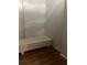Bed inside the sleeping alcove with dark laminate wood flooring at 20 Marietta Nw St # 10 F, Atlanta, GA 30303