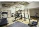 On-site fitness center with exercise equipment, including a treadmill and weight machines at 20 Marietta Nw St # 10 F, Atlanta, GA 30303
