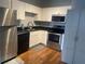 The kitchen features white cabinets, stainless steel appliances, and dark countertops at 20 Marietta Nw St # 10 F, Atlanta, GA 30303