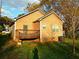 The backyard of this cozy home features a deck, some grass and a clean, light-colored exterior at 207 Brownlee Sw Rd, Atlanta, GA 30331