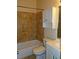 Well-maintained bathroom with tiled walls, a vanity, and storage cabinets at 207 Brownlee Sw Rd, Atlanta, GA 30331
