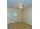 Bedroom with a ceiling fan, neutral walls, a window, and carpet flooring at 207 Brownlee Sw Rd, Atlanta, GA 30331