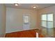 Bright dining area with hardwood floors and a door leading to the backyard at 207 Brownlee Sw Rd, Atlanta, GA 30331