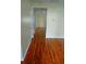 Hallway featuring beautiful hardwood floors, connecting different areas of the home at 207 Brownlee Sw Rd, Atlanta, GA 30331