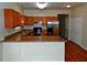 Eat-in kitchen with wooden cabinets, granite countertops, and a stainless-steel refrigerator at 207 Brownlee Sw Rd, Atlanta, GA 30331