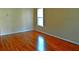 Bright living room with gleaming hardwood floors and a view from the window at 207 Brownlee Sw Rd, Atlanta, GA 30331