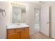 Well-lit bathroom featuring a vanity with wood cabinets and view to another room at 4535 Howell Farms Nw Rd, Acworth, GA 30101