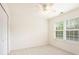 Standard bedroom featuring plush carpet, bright natural light and standard closet at 4535 Howell Farms Nw Rd, Acworth, GA 30101