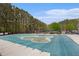 A community pool is ready for the summer season, currently covered in a protective tarp at 4535 Howell Farms Nw Rd, Acworth, GA 30101