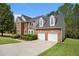 A well-maintained, two-story brick home, featuring a two-car garage and manicured landscaping at 4535 Howell Farms Nw Rd, Acworth, GA 30101