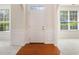 Bright foyer features hardwood floors, white wainscoting and arched entryways at 4535 Howell Farms Nw Rd, Acworth, GA 30101