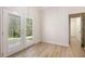 Hallway to the backyard featuring lovely french doors and luxury vinyl plank flooring at 4535 Howell Farms Nw Rd, Acworth, GA 30101