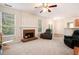 Bright living room with fireplace, windows, and comfortable seating at 4535 Howell Farms Nw Rd, Acworth, GA 30101