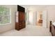 Bright main bedroom with plush carpeting, great natural light and view to ensuite bathroom at 4535 Howell Farms Nw Rd, Acworth, GA 30101