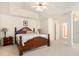 Spacious main bedroom featuring vaulted ceilings, plush carpeting and a beautiful wooden bed at 4535 Howell Farms Nw Rd, Acworth, GA 30101