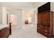 Spacious main bedroom with a sitting area, neutral carpet, and a large wardrobe with a television on top at 4535 Howell Farms Nw Rd, Acworth, GA 30101